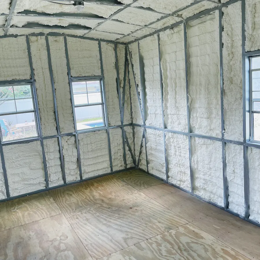 Closed-cell spray foam insulation applied to wall cavities in a residential project in Farmville